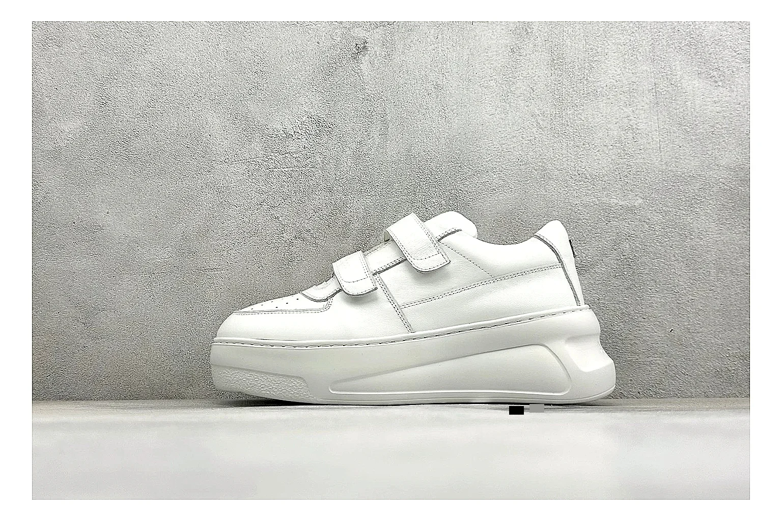 Acne Studios Velcro White Mid-Top shopping brief image showing white leather panels, broad hook-and-loop straps, padded mid-top collar, and a clean rubber sole