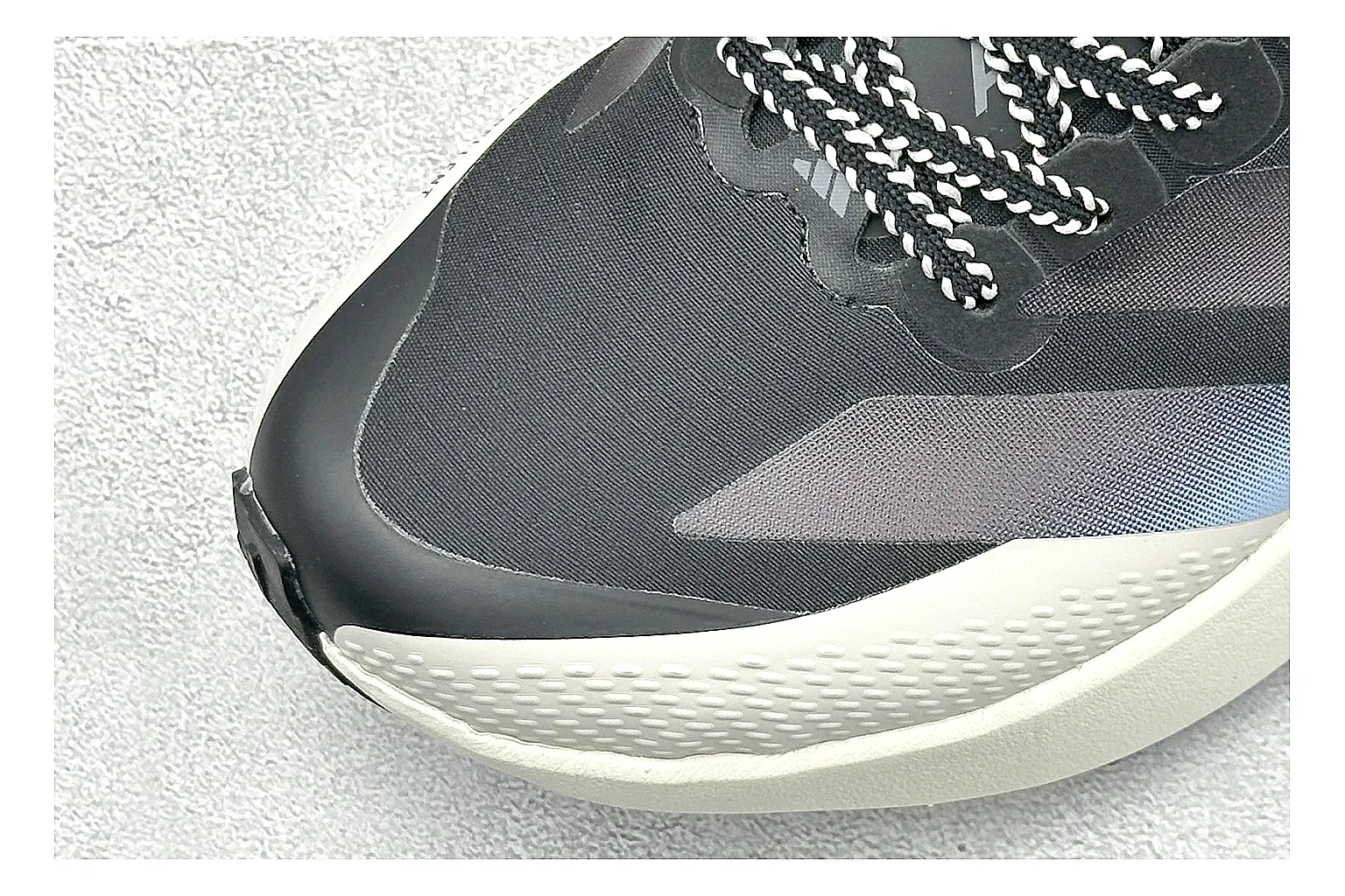 Adidas Adizero Evo Black shopping brief photo showing black racing upper, sculpted white sole, Adidas striping, and lightweight performance silhouette thumbnail 3