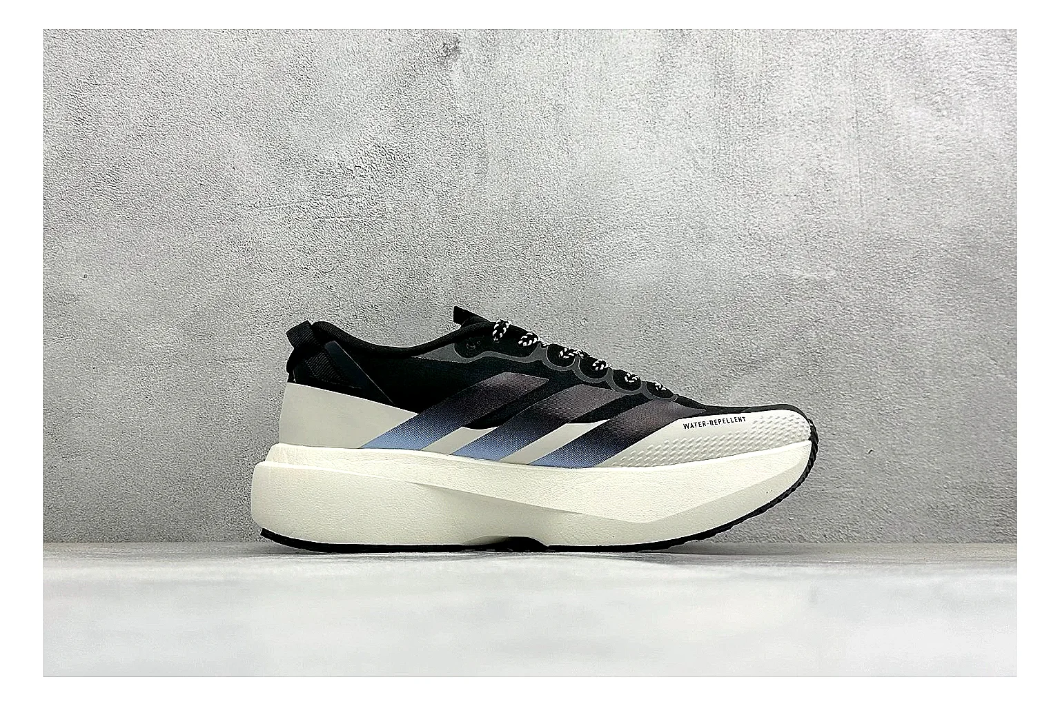 Adidas Adizero Evo Black shopping brief photo showing black racing upper, sculpted white sole, Adidas striping, and lightweight performance silhouette thumbnail 4