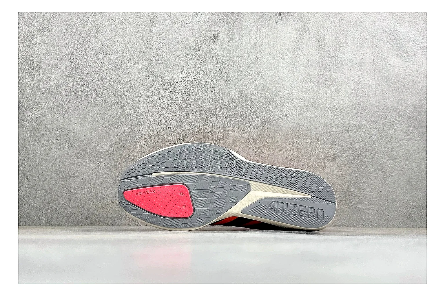 Adidas Adizero Orange Black shopping brief photo showing orange runner upper, black three-stripe contrast, lightweight racing shape, and thin performance sole thumbnail 2