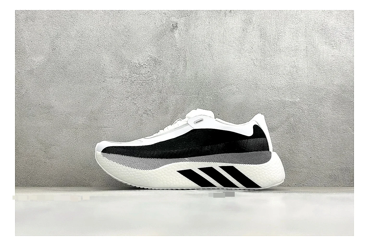 Adidas Hyper Boost White Black shopping brief photo showing white knit runner upper, black Adidas striping, sculpted Boost-style sole, and modern low runner profile