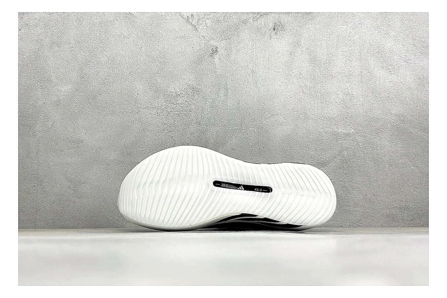 Adidas Hyper Boost White Black shopping brief photo showing white knit runner upper, black Adidas striping, sculpted Boost-style sole, and modern low runner profile thumbnail 2