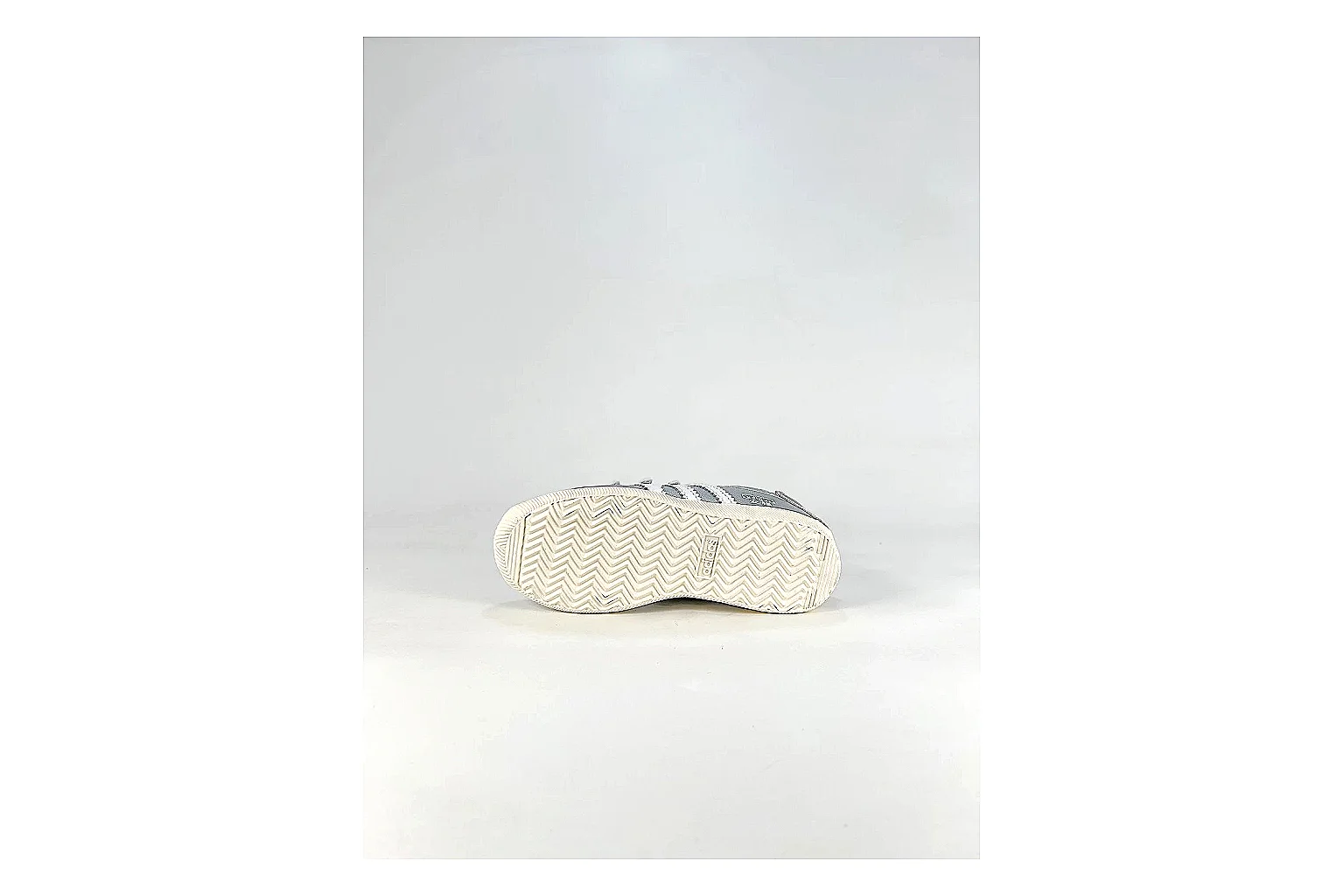 Adidas Originals Anfisa Silver Sneakers shopping brief image showing silver low-top sneakers with leather texture, side-profile shape, upper panel lines, and outsole detail thumbnail 2