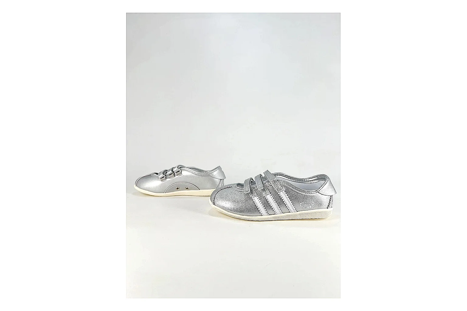 Adidas Originals Anfisa Silver Sneakers shopping brief image showing silver low-top sneakers with leather texture, side-profile shape, upper panel lines, and outsole detail thumbnail 3