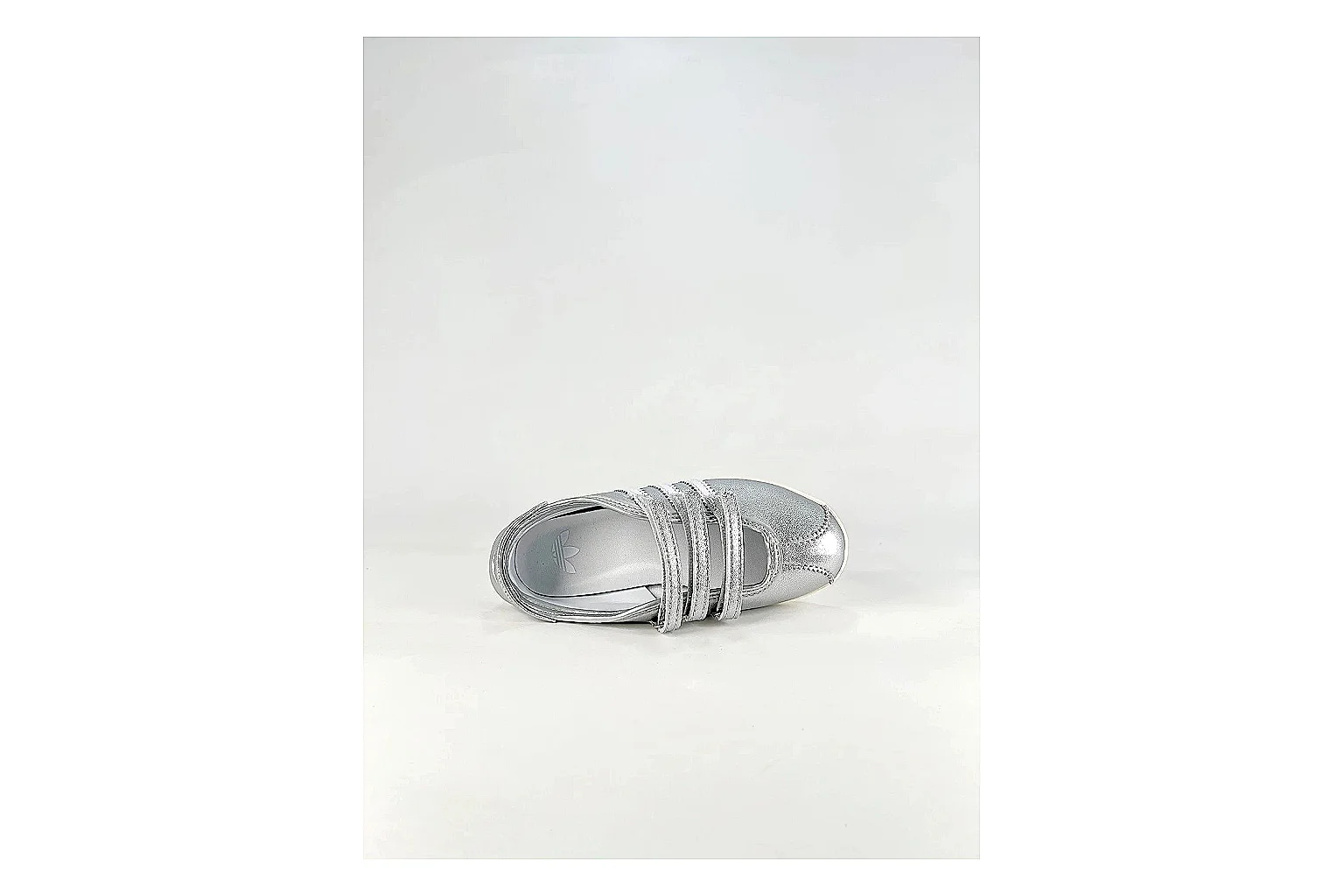 Adidas Originals Anfisa Silver Sneakers shopping brief image showing silver low-top sneakers with leather texture, side-profile shape, upper panel lines, and outsole detail thumbnail 5
