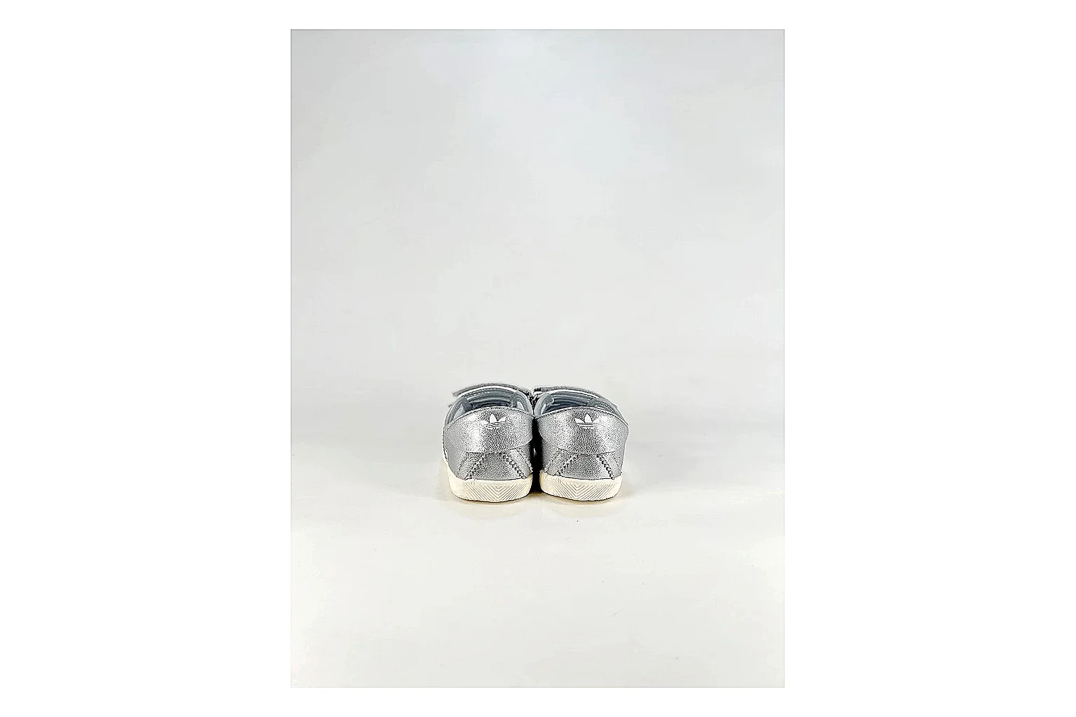 Adidas Originals Anfisa Silver Sneakers shopping brief image showing silver low-top sneakers with leather texture, side-profile shape, upper panel lines, and outsole detail thumbnail 6