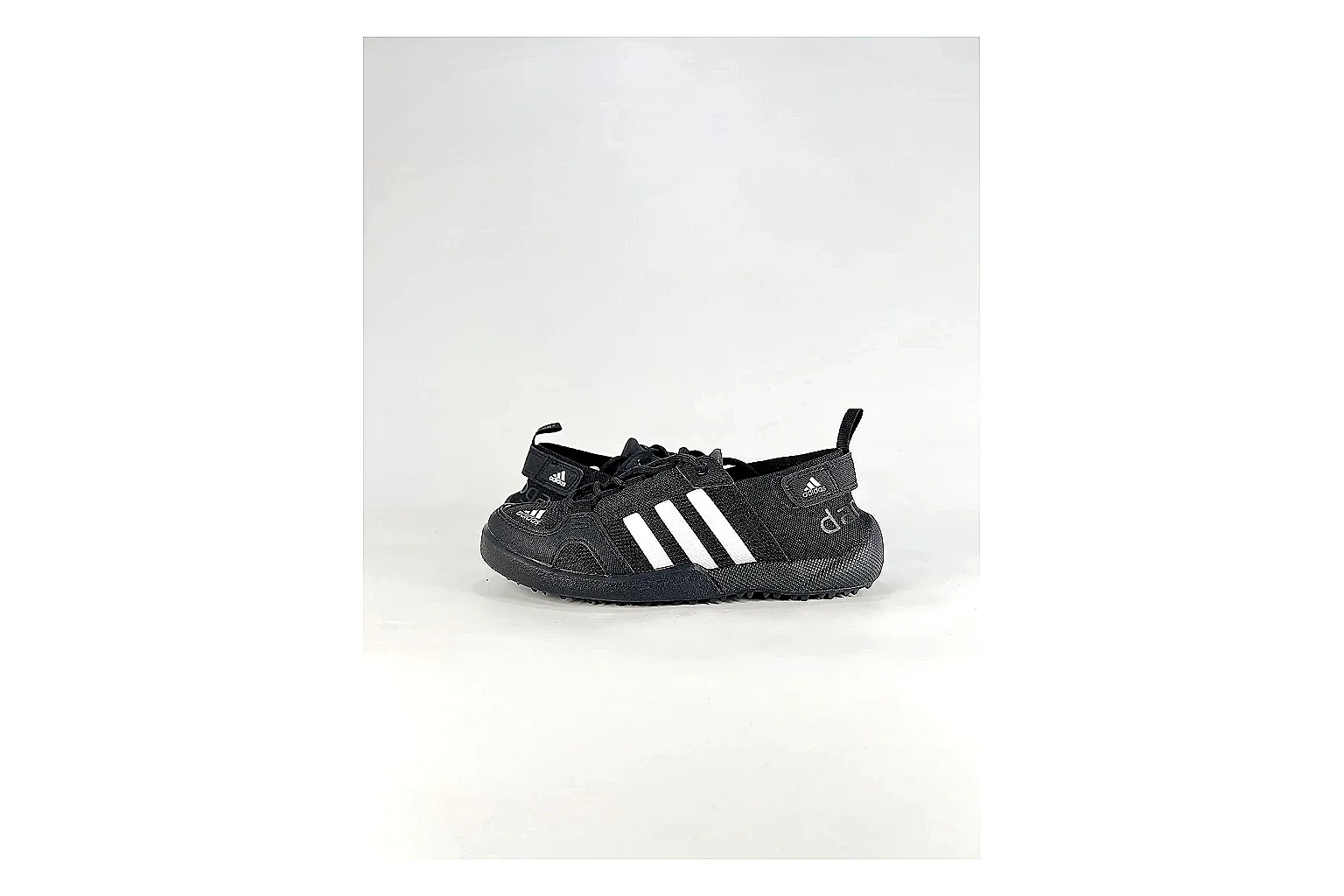 Adidas Originals Daroga Black White Sneakers shopping brief image showing black white low-top sneakers with mesh texture, side-profile shape, upper panel lines, and outsole detail