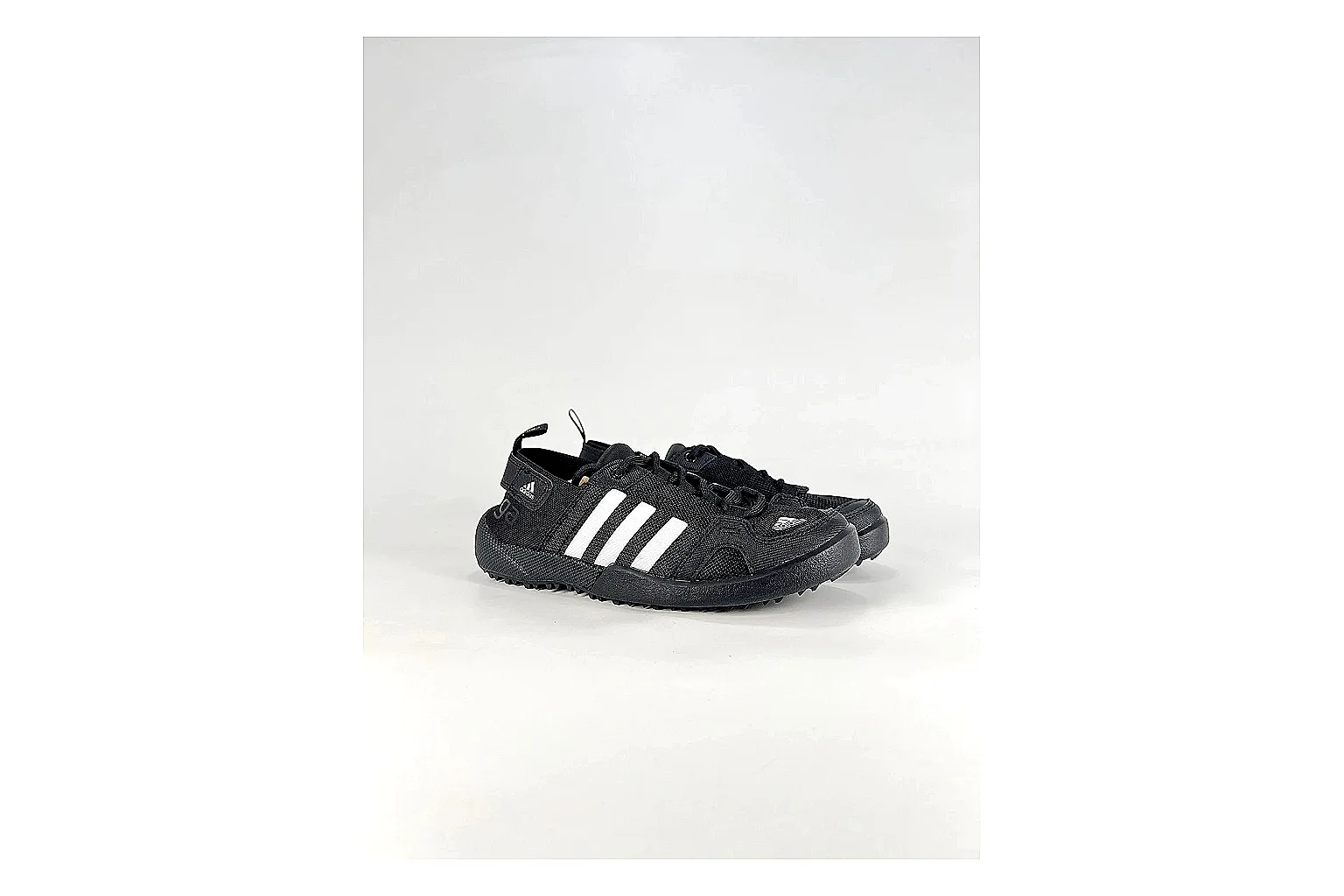 Adidas Originals Daroga Black White Sneakers shopping brief image showing black white low-top sneakers with mesh texture, side-profile shape, upper panel lines, and outsole detail thumbnail 4