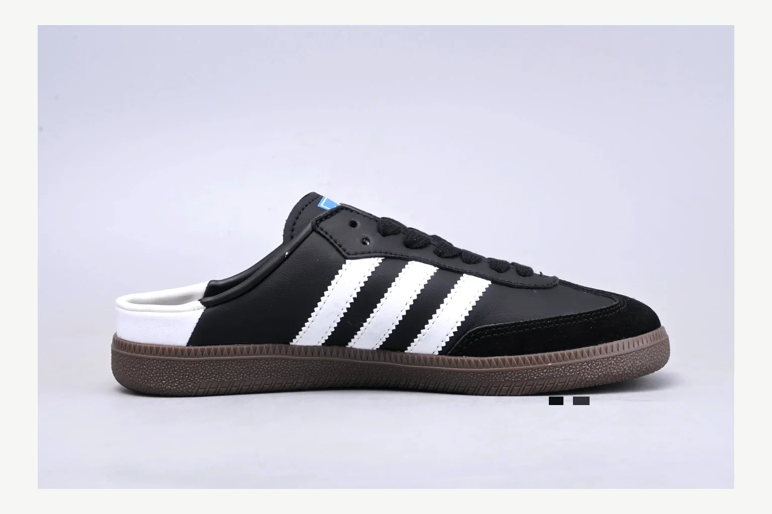 Adidas Originals Samba Black White shopping brief image showing white black low-top sneaker with mixed-material upper and low-profile shape