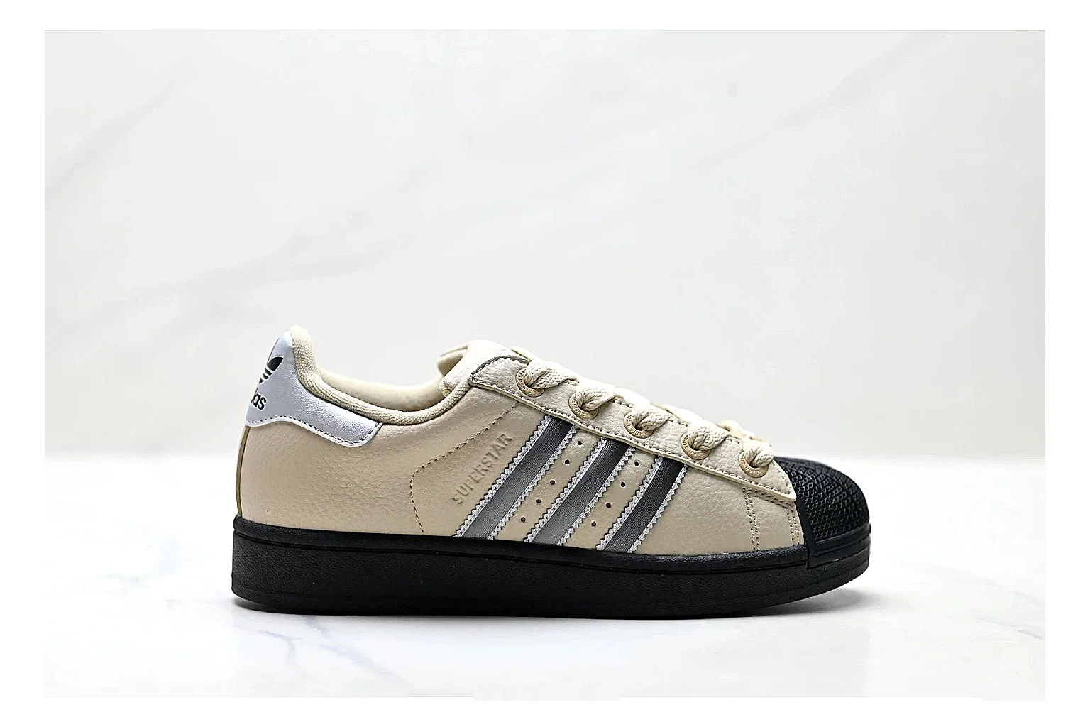Adidas Originals Samba Cream Black Sneakers shopping brief image showing cream black terrace sneakers with leather texture, side-profile shape, upper panel lines, and outsole detail