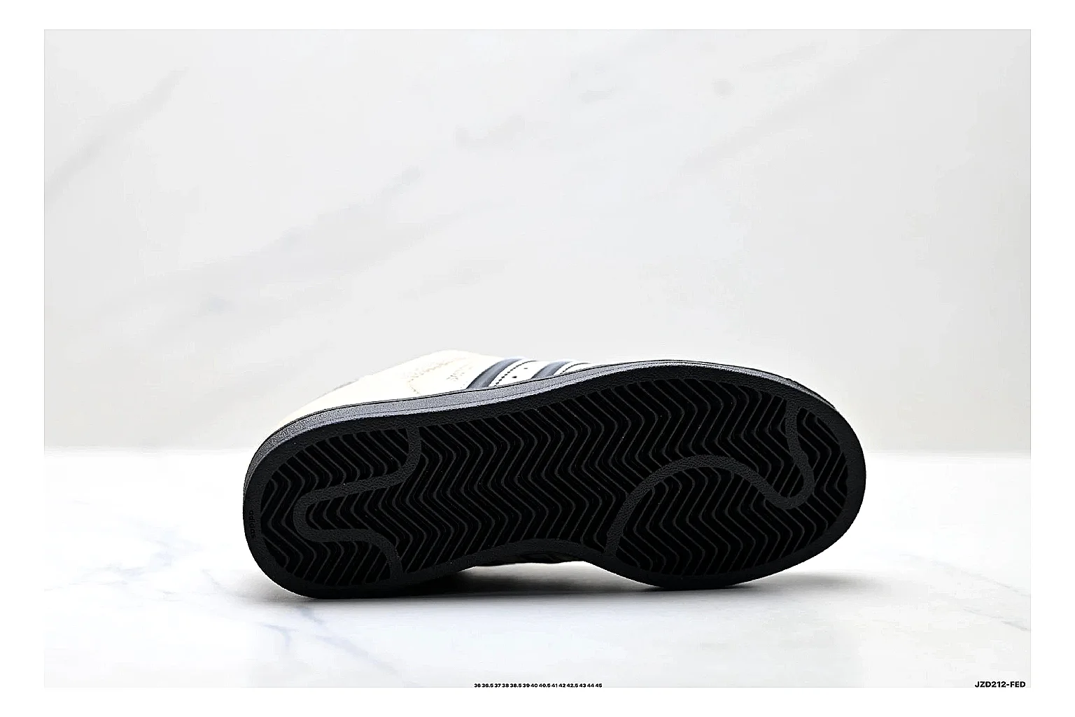Adidas Originals Samba Cream Black Sneakers shopping brief image showing cream black terrace sneakers with leather texture, side-profile shape, upper panel lines, and outsole detail thumbnail 2