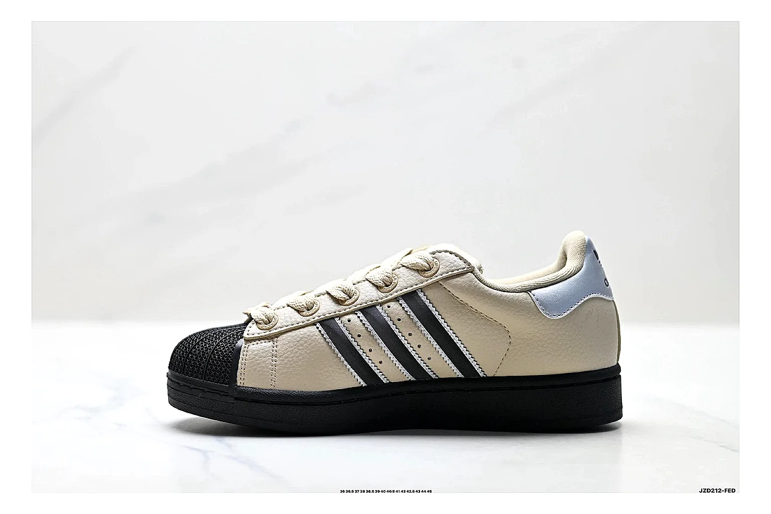 Adidas Originals Samba Cream Black Sneakers shopping brief image showing cream black terrace sneakers with leather texture, side-profile shape, upper panel lines, and outsole detail thumbnail 4