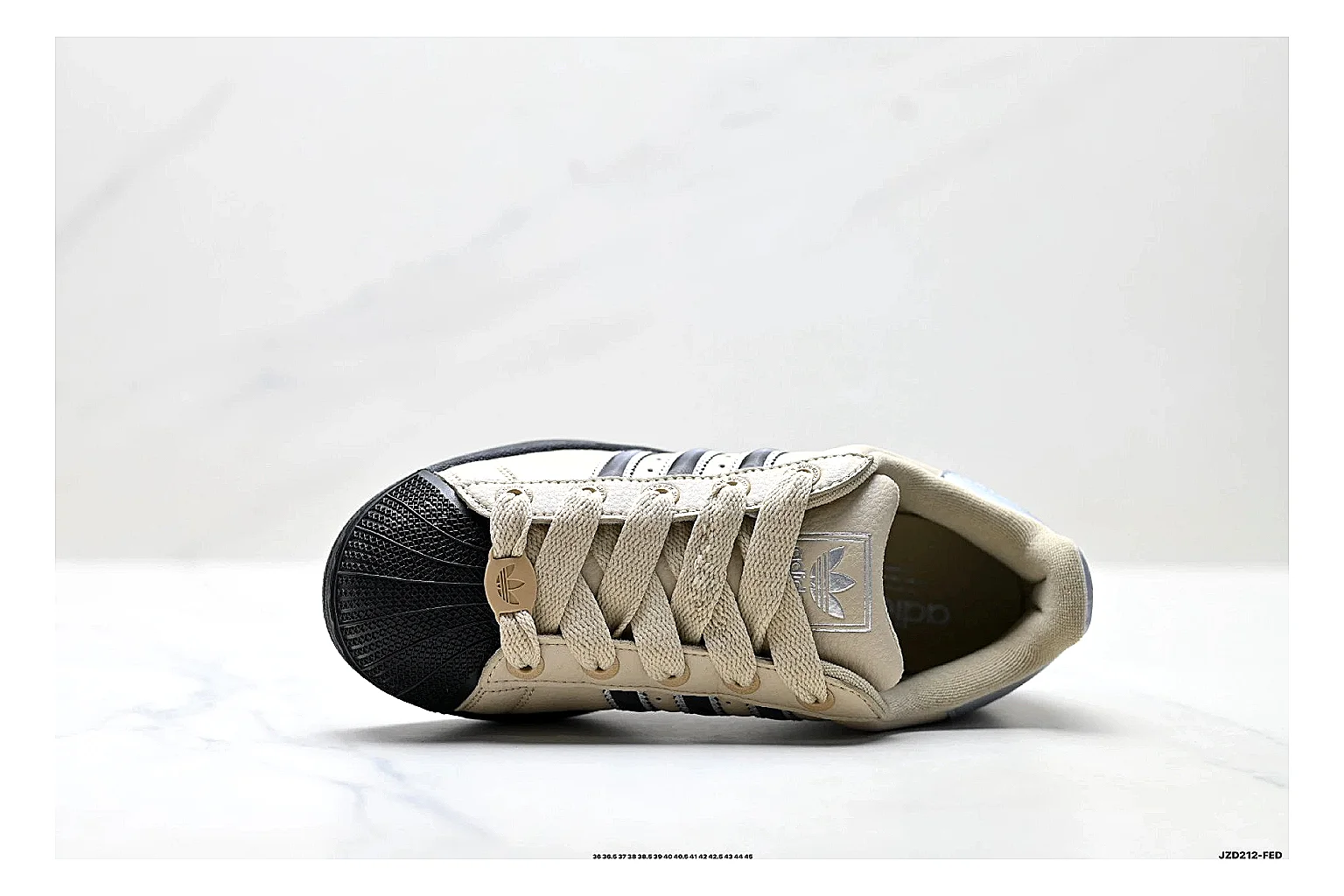 Adidas Originals Samba Cream Black Sneakers shopping brief image showing cream black terrace sneakers with leather texture, side-profile shape, upper panel lines, and outsole detail thumbnail 5