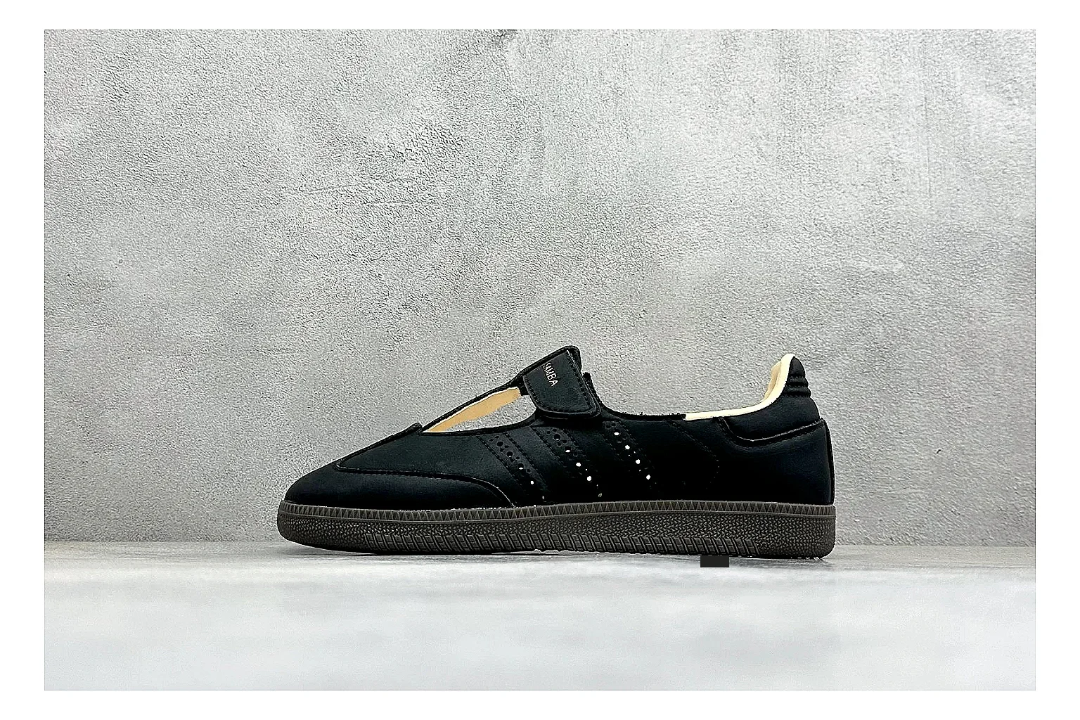 Adidas Samba Jane Black shopping brief photo showing black Mary Jane upper, Samba-style stripes, strap closure, gum outsole, and low terrace shape