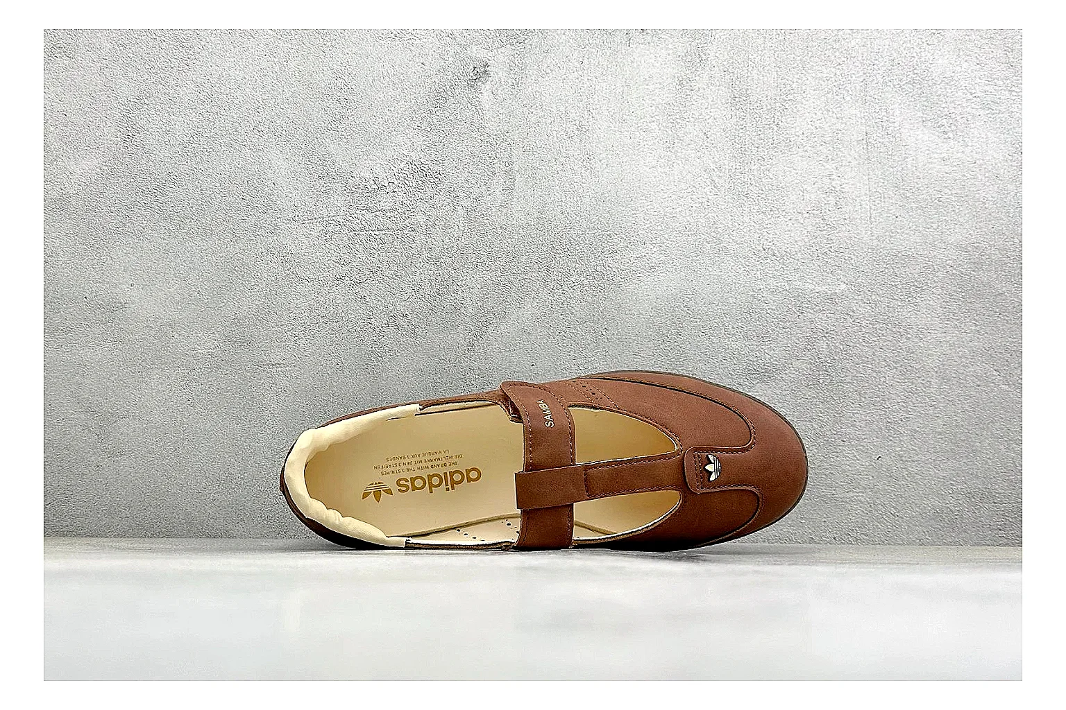 Adidas Samba Jane Brown shopping brief photo showing brown Mary Jane upper, Samba-style side stripes, strap closure, gum outsole, and low terrace profile thumbnail 5