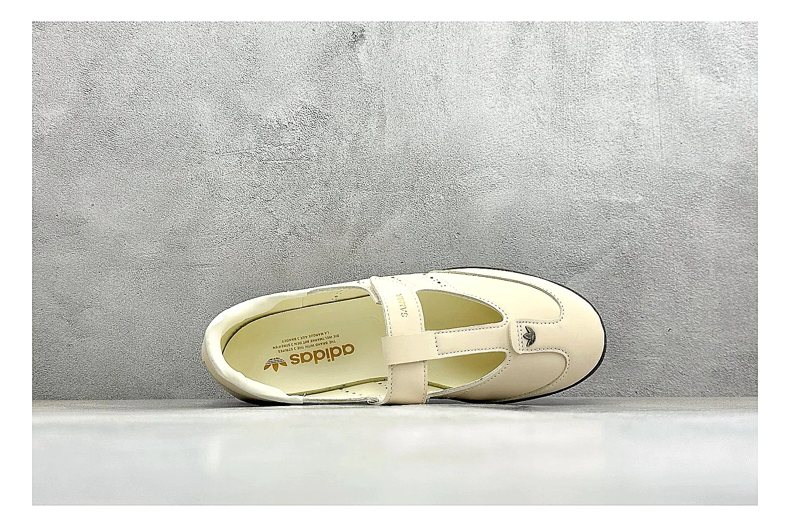 Adidas Samba Jane Cream shopping brief photo showing cream Mary Jane upper, dark gum outsole, Samba-style side stripes, and low strap silhouette thumbnail 5