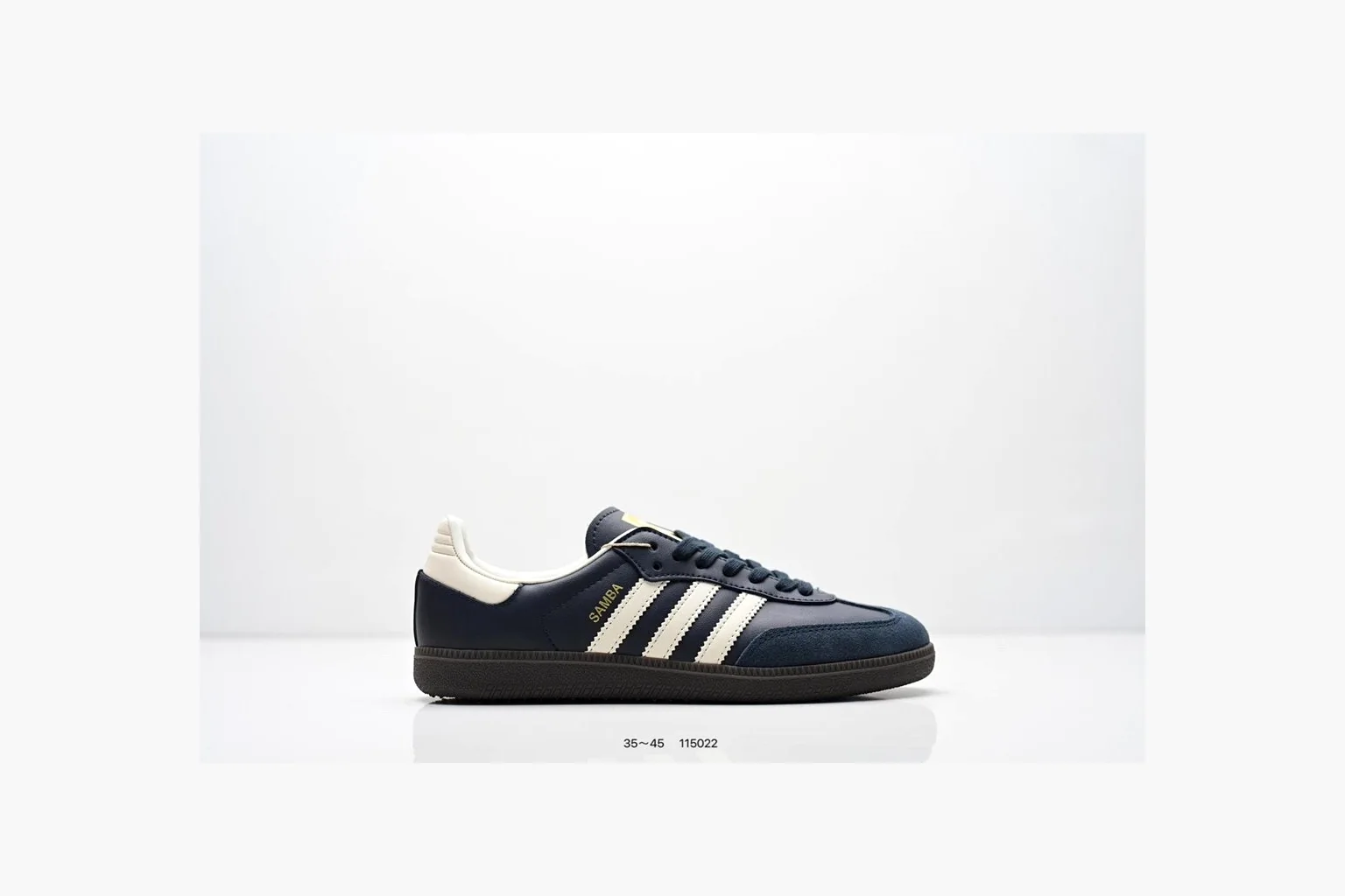Adidas Samba OG Black White Gold shopping brief photo showing black leather-suede low-top upper, white three stripes, gold tongue label, gum sole, and classic Samba side profile