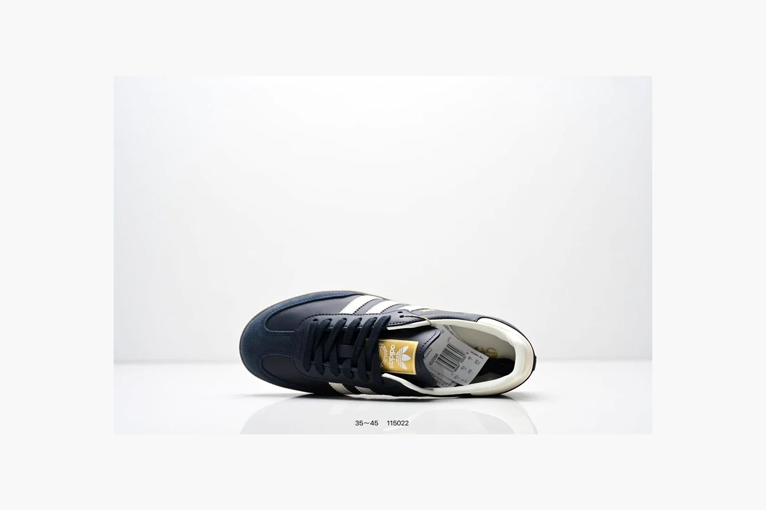 Adidas Samba OG Black White Gold shopping brief photo showing black leather-suede low-top upper, white three stripes, gold tongue label, gum sole, and classic Samba side profile thumbnail 5