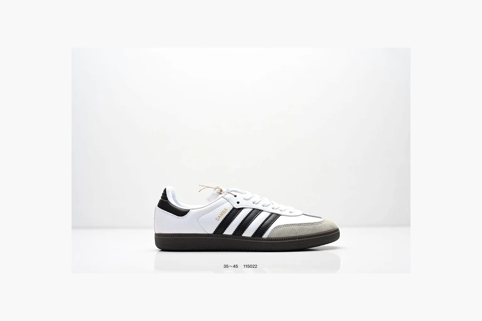 Adidas Samba OG White Black Blue shopping brief photo showing white leather-suede low-top upper, black three stripes, blue heel detail, gum terrace sole, and slim Samba profile