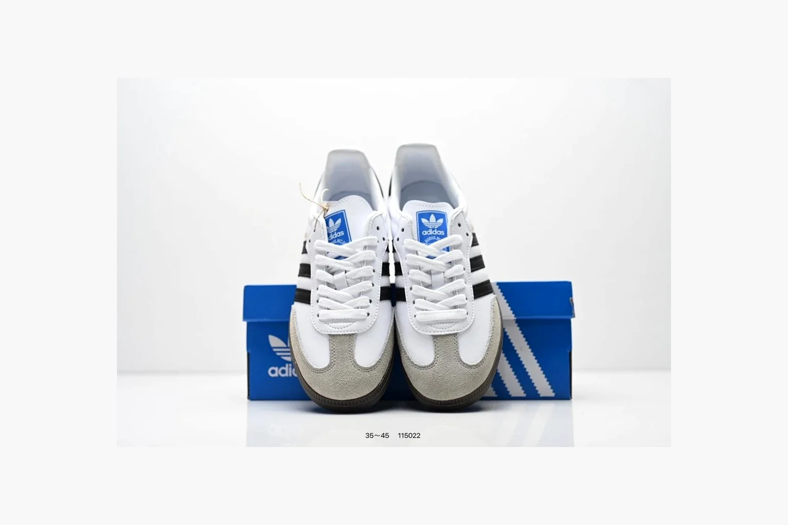 Adidas Samba OG White Black Blue shopping brief photo showing white leather-suede low-top upper, black three stripes, blue heel detail, gum terrace sole, and slim Samba profile thumbnail 3