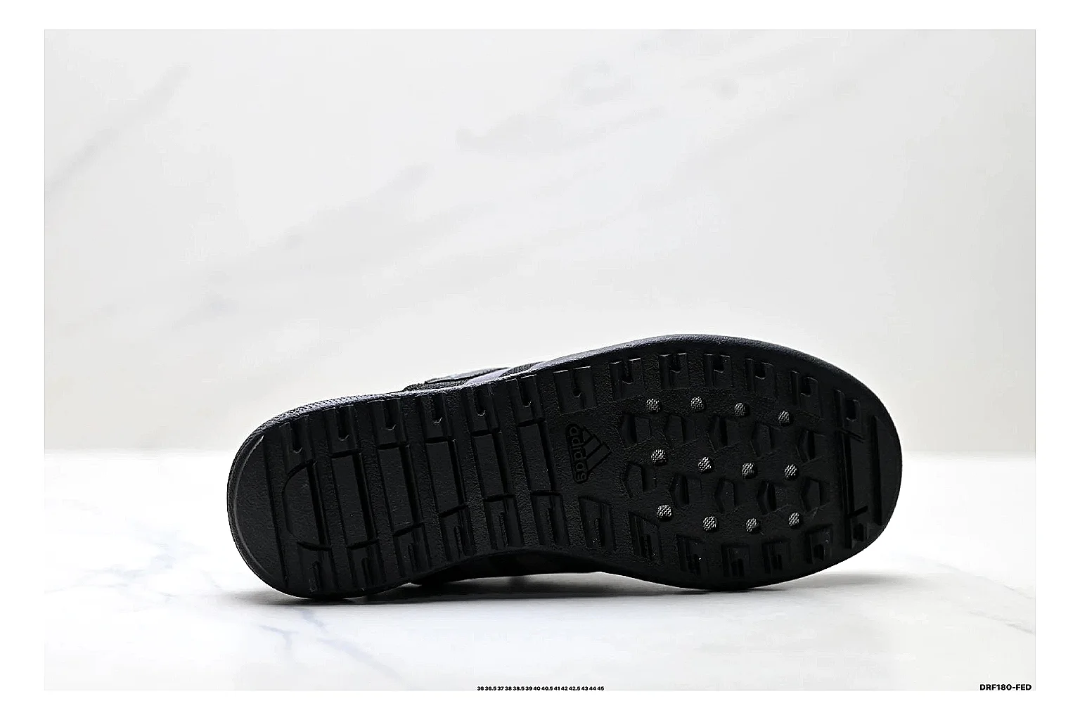 Adidas Terrex Daroga Black Sneakers shopping brief image showing black outdoor trail sneakers with mesh texture, side-profile shape, upper panel lines, and outsole detail thumbnail 2