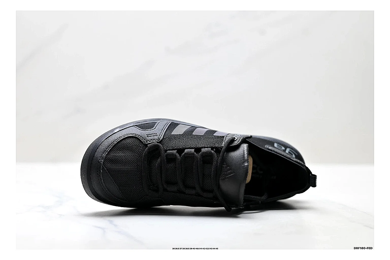 Adidas Terrex Daroga Black Sneakers shopping brief image showing black outdoor trail sneakers with mesh texture, side-profile shape, upper panel lines, and outsole detail thumbnail 5