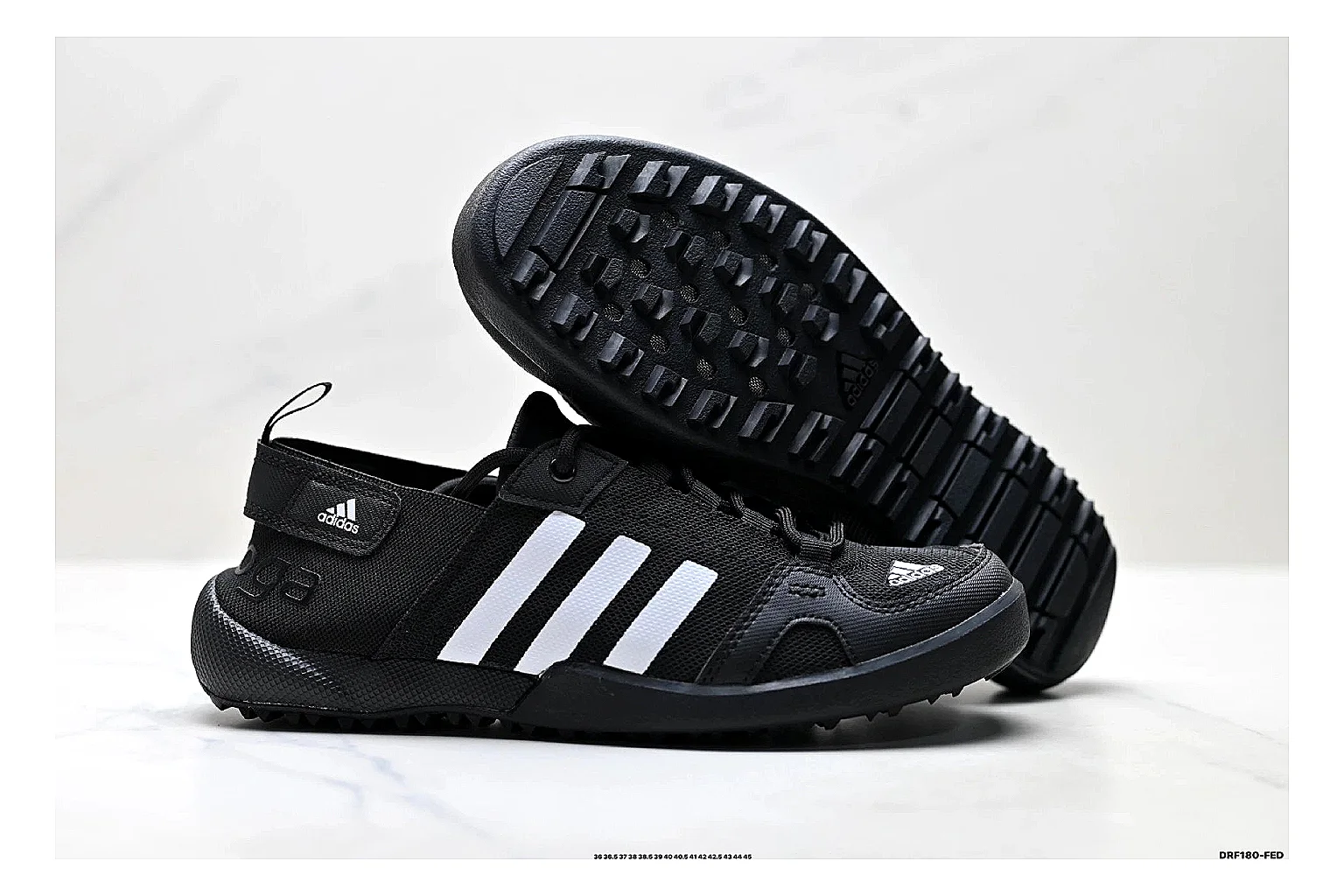 Adidas Terrex Daroga Black White Sneakers shopping brief image showing black white outdoor trail sneakers with mesh texture, side-profile shape, upper panel lines, and outsole detail thumbnail 3