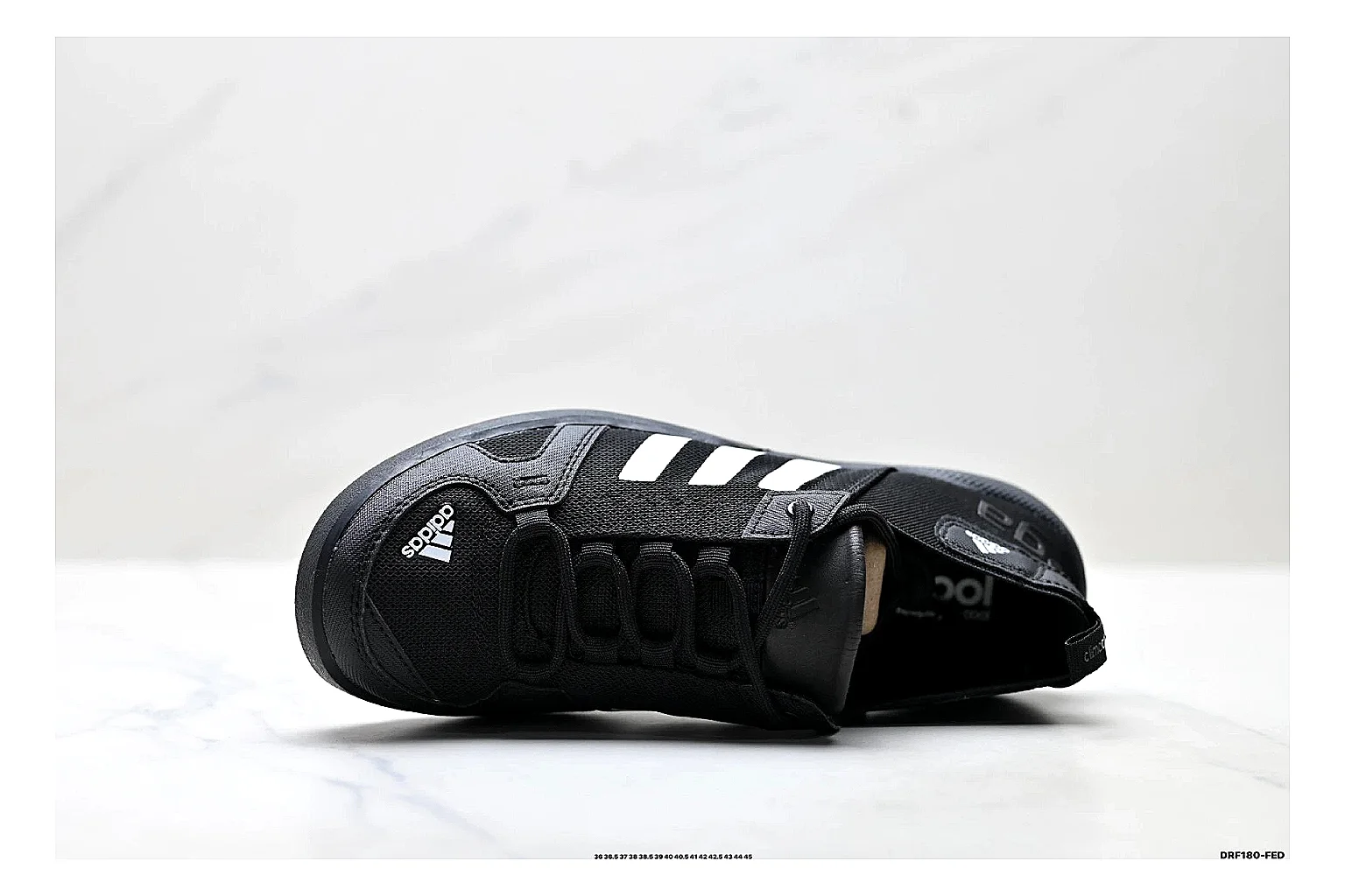 Adidas Terrex Daroga Black White Sneakers shopping brief image showing black white outdoor trail sneakers with mesh texture, side-profile shape, upper panel lines, and outsole detail thumbnail 5