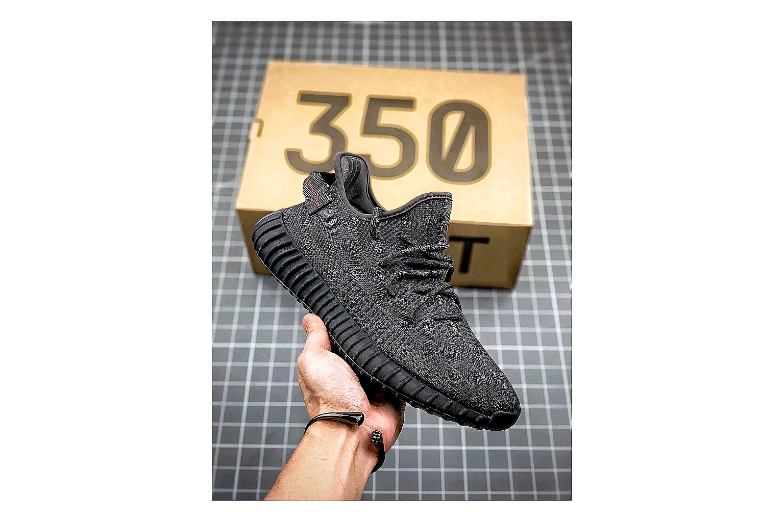 Adidas Yeezy 350 Boost Black shopping brief image showing black yeezy 350 knit runner with knit upper and knit shape thumbnail 4