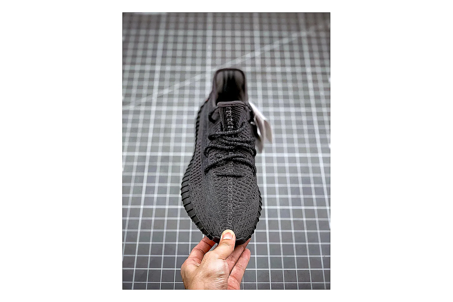 Adidas Yeezy 350 Boost Black shopping brief image showing black yeezy 350 knit runner with knit upper and knit shape thumbnail 5