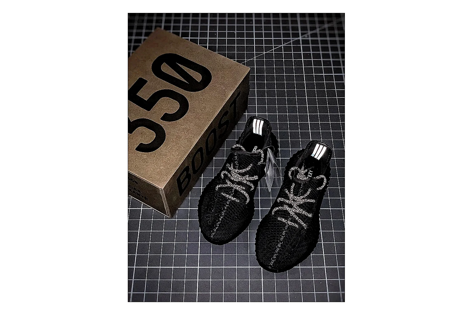 Adidas Yeezy 350 Boost Black shopping brief image showing black yeezy 350 knit runner with knit upper and knit shape thumbnail 6