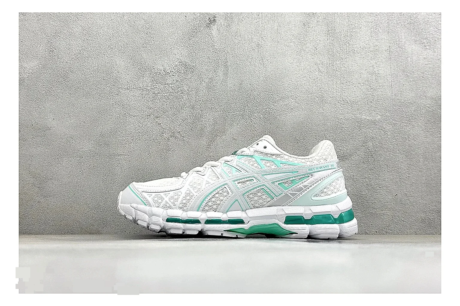 Asics Gel-Kayano White Mint shopping brief photo showing white mesh runner upper, mint Asics accents, cushioned Gel-Kayano sole, and technical support shape
