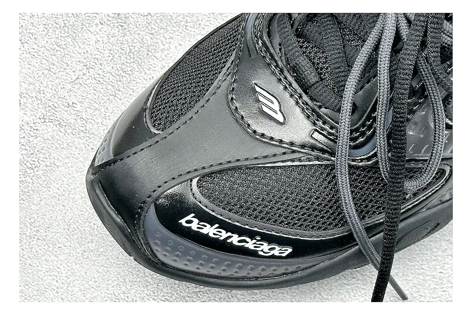 Balenciaga Track Black Low-Top shopping brief photo showing black layered technical upper, complex paneling, chunky runner sole, and tactical low-top shape thumbnail 3