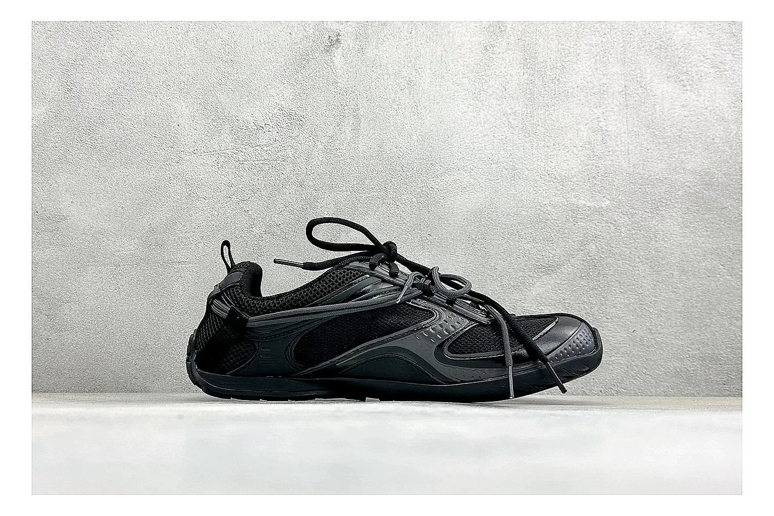 Balenciaga Track Black Low-Top shopping brief photo showing black layered technical upper, complex paneling, chunky runner sole, and tactical low-top shape thumbnail 4