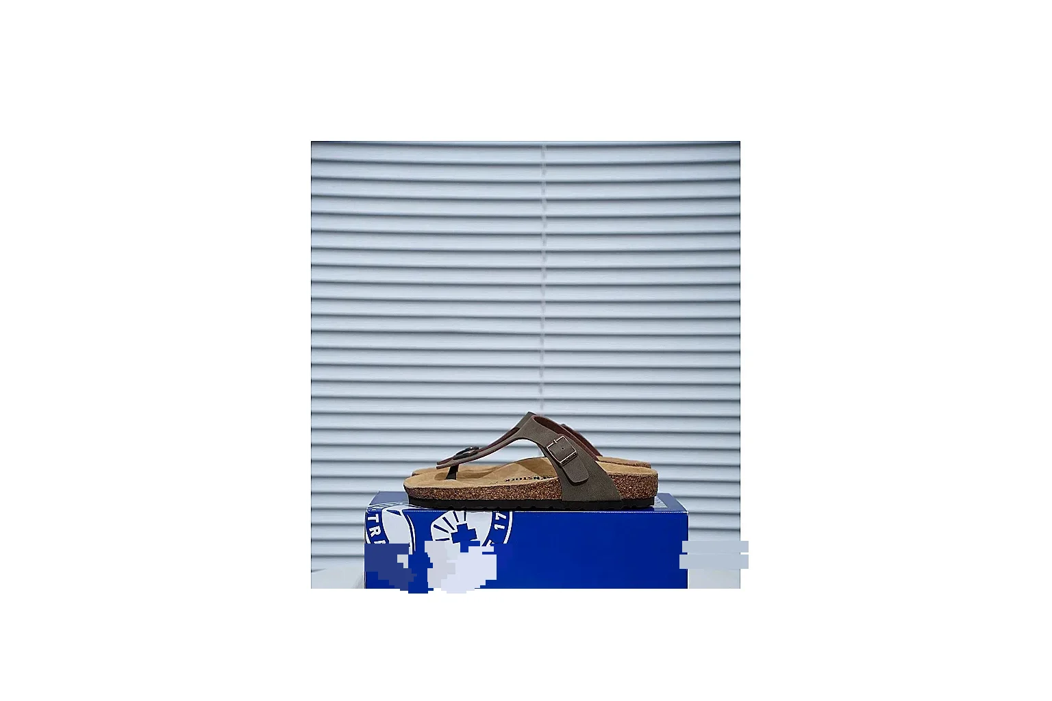 Birkenstock Arizona Taupe Cork Slide shopping brief image showing neutral upper, adjustable buckles and contoured footbed for easy daily wear