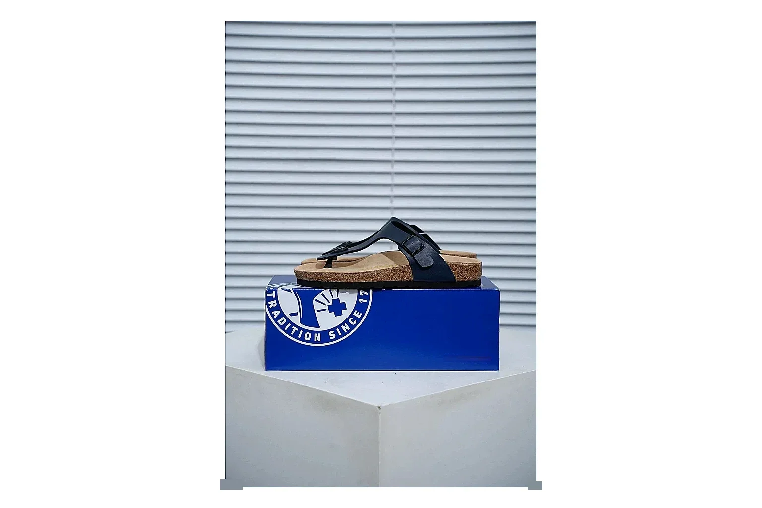 Birkenstock Black Toe Loop Cork Sandal shopping brief image showing slim straps, adjustable buckle and contoured footbed for light summer wear