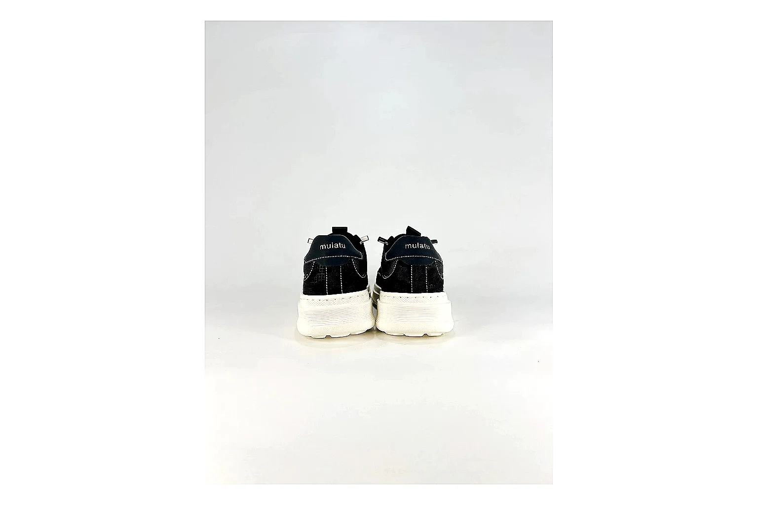 Boss Low Top Black White shopping brief photo showing black white leather low-top upper, minimal casual profile, clean panels, and simple rubber sole thumbnail 2
