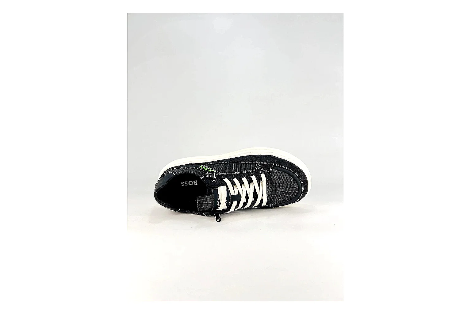 Boss Low Top Black White shopping brief photo showing black white leather low-top upper, minimal casual profile, clean panels, and simple rubber sole thumbnail 3