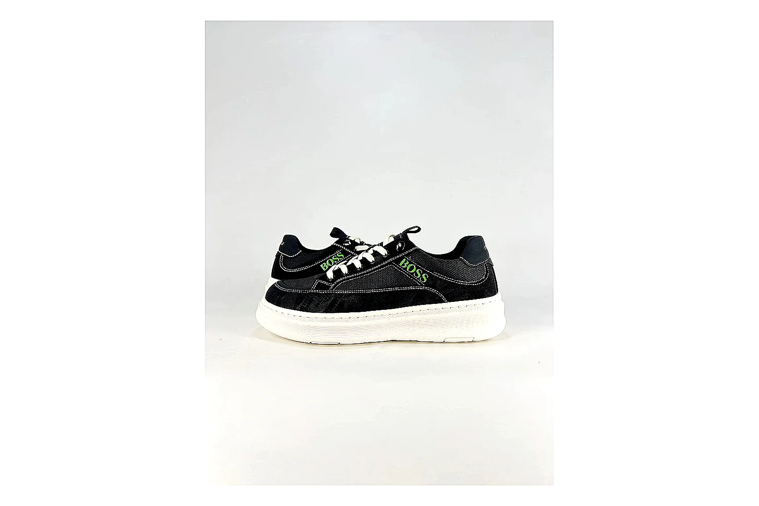 Boss Low Top Black White shopping brief photo showing black white leather low-top upper, minimal casual profile, clean panels, and simple rubber sole thumbnail 4