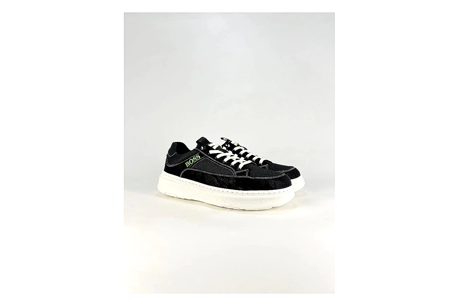 Boss Low Top Black White shopping brief photo showing black white leather low-top upper, minimal casual profile, clean panels, and simple rubber sole thumbnail 5