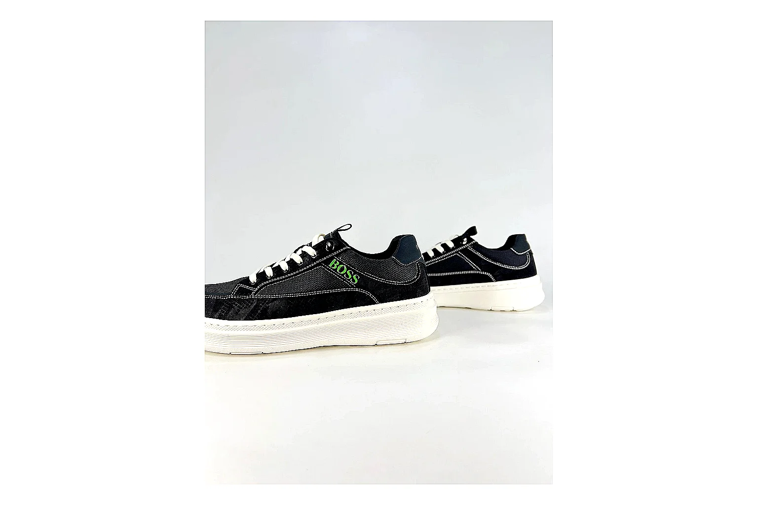 Boss Low Top Black White shopping brief photo showing black white leather low-top upper, minimal casual profile, clean panels, and simple rubber sole thumbnail 6
