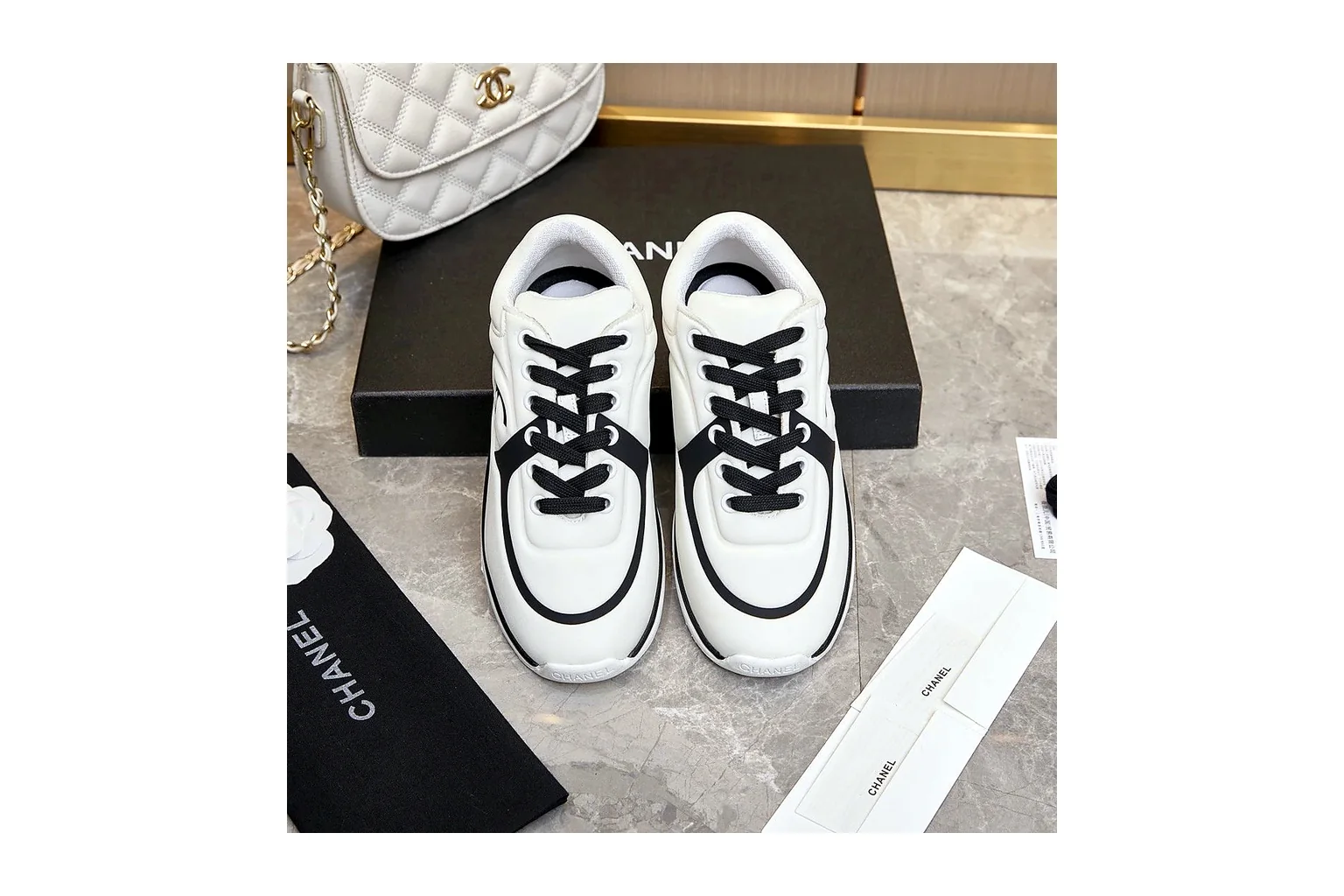 Chanel CC Low Top White Black luxury low top six photo view thumbnail 5