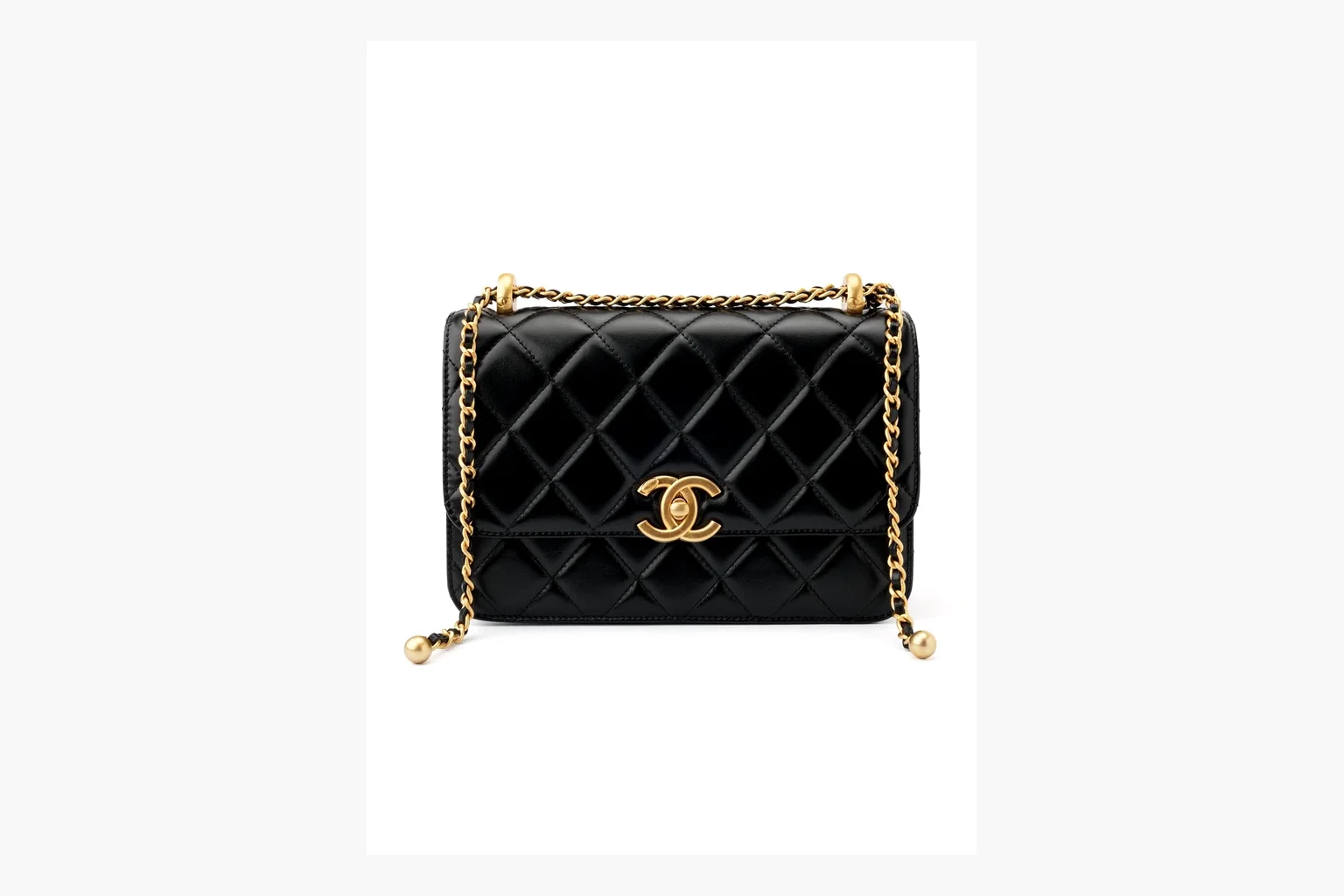 Chanel Black Quilted Chain Flap Bag shopping brief photo showing black quilted leather flap body, gold chain strap, CC front logo, rectangular shoulder-bag shape, and polished hardware thumbnail 2
