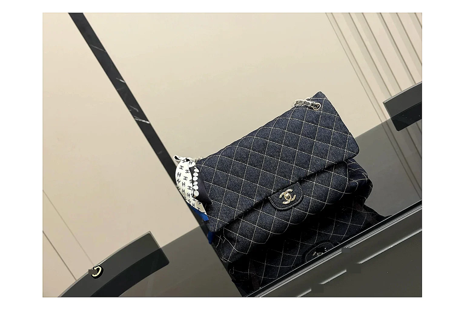 Chanel Quilted Flap Bag Black Denim shopping brief photo showing black denim-look quilted flap body, shoulder-bag shape, chain strap, and polished hardware