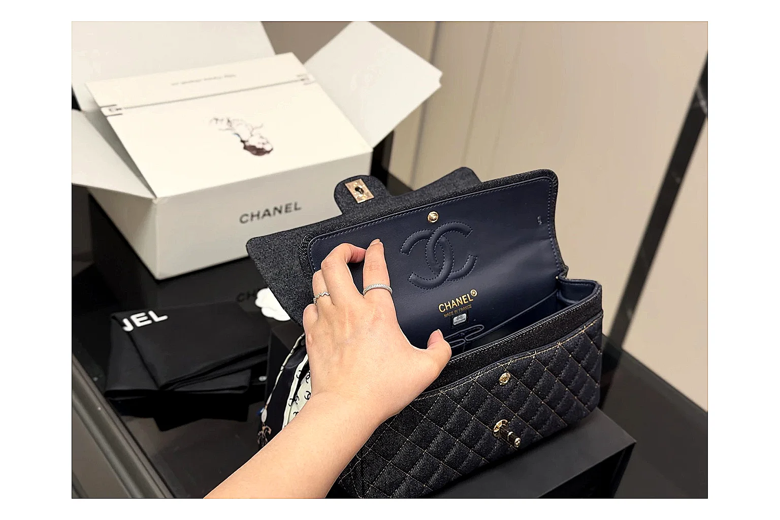 Chanel Quilted Flap Bag Black Navy shopping brief photo showing black navy quilted leather body, flap structure, chain strap, and polished luxury hardware thumbnail 2