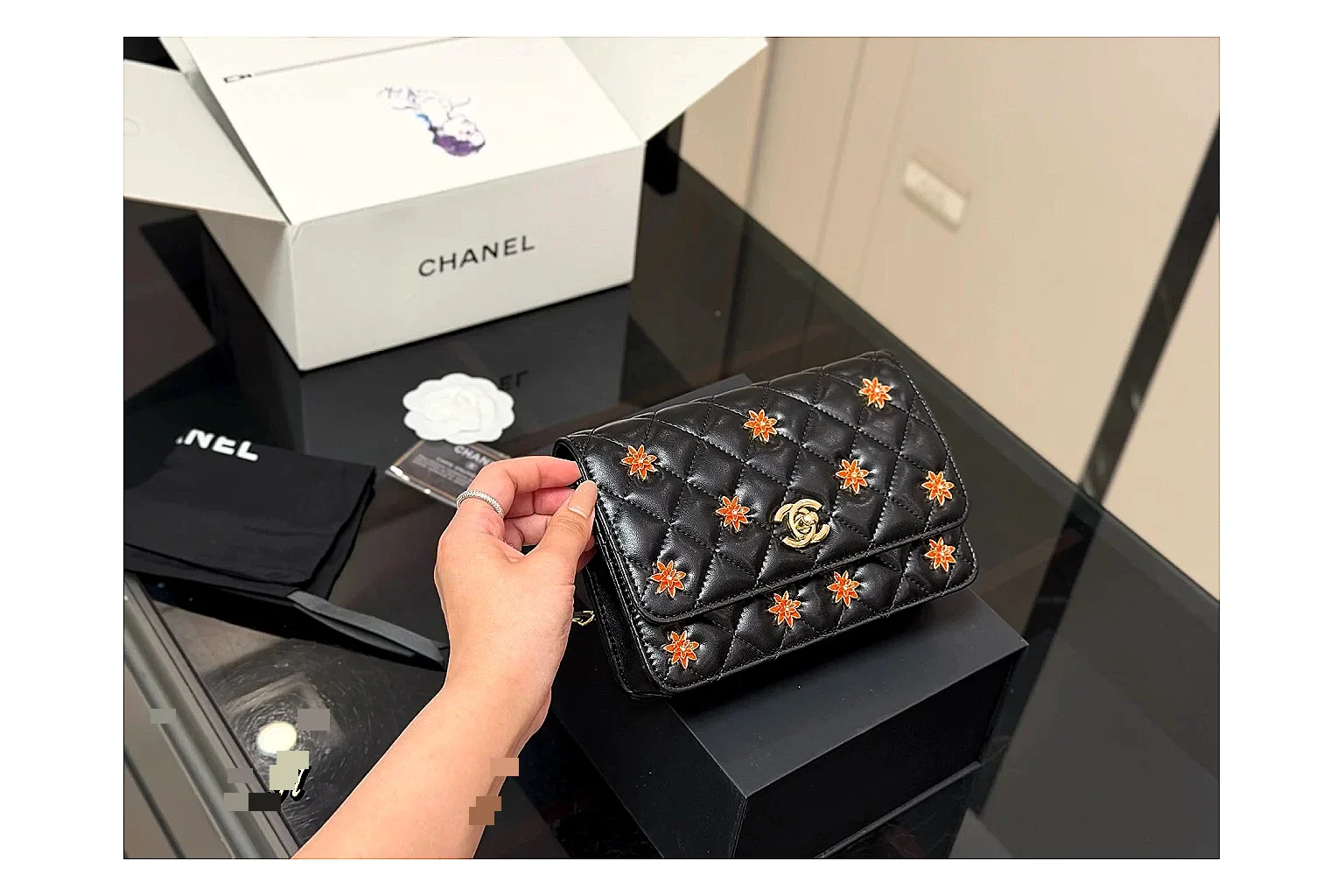Chanel Quilted Wallet Bag Black Floral shopping brief photo showing black quilted wallet-bag body, floral detail, compact flap shape, and polished chain hardware