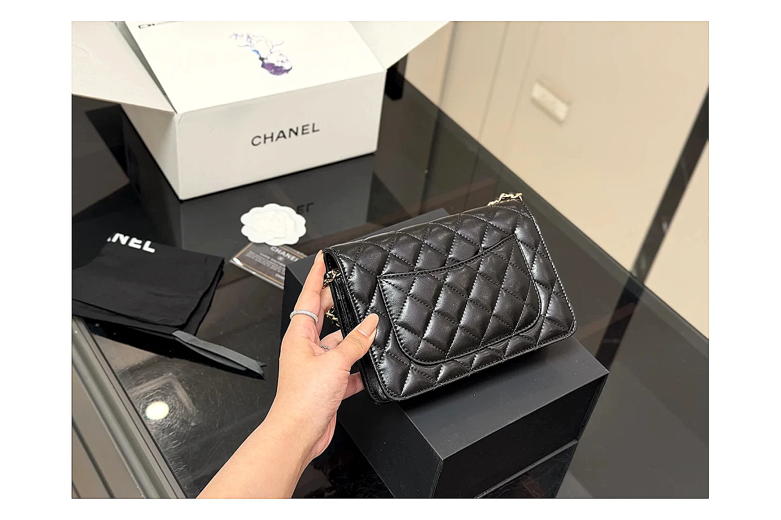 Chanel Quilted Wallet Bag Black Floral shopping brief photo showing black quilted wallet-bag body, floral detail, compact flap shape, and polished chain hardware thumbnail 3