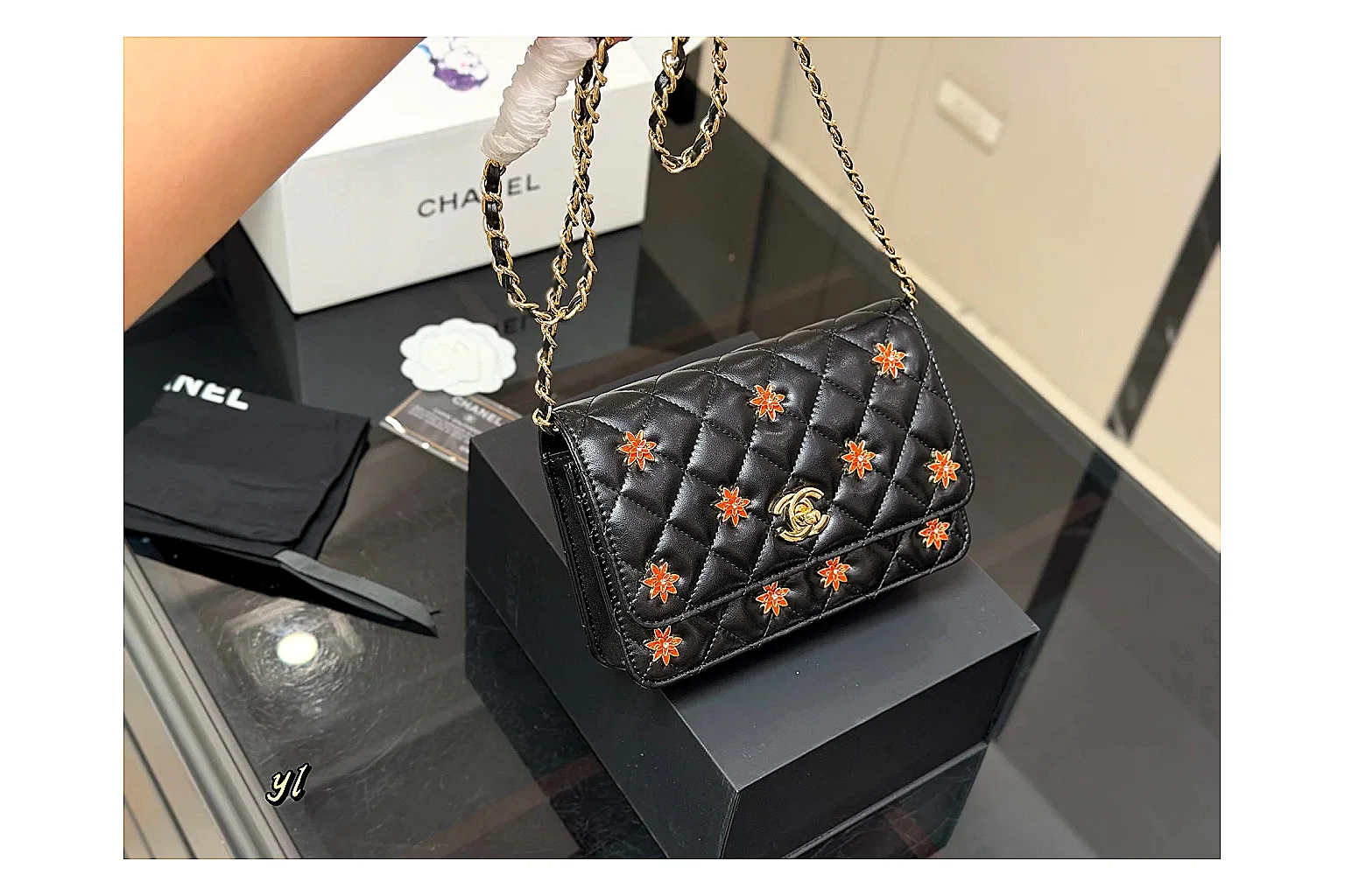 Chanel Quilted Wallet Bag Black Floral shopping brief photo showing black quilted wallet-bag body, floral detail, compact flap shape, and polished chain hardware thumbnail 4