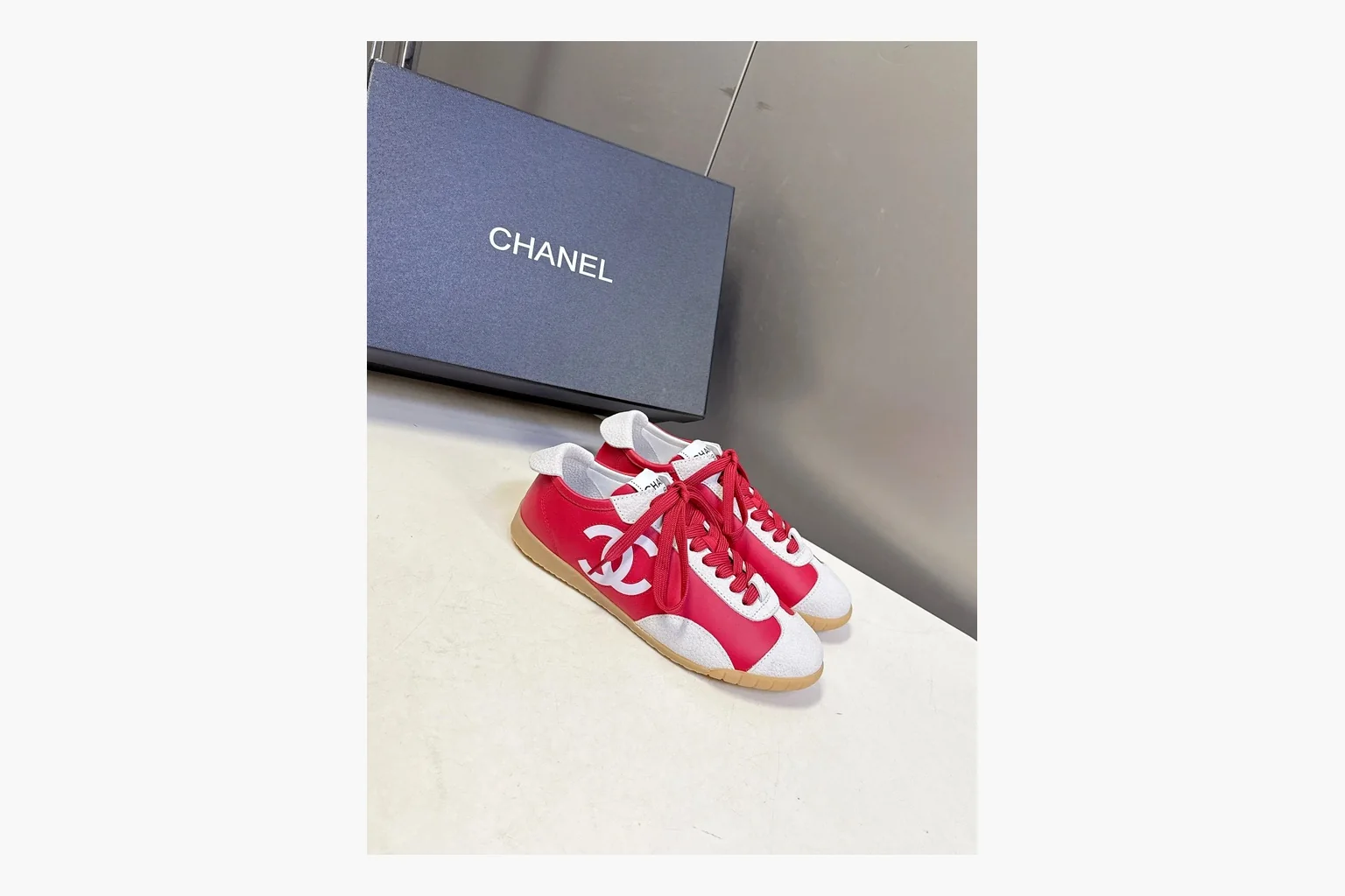 Chanel Red White Platform Sneaker shopping brief photo showing red and white low-top upper, platform sole, leather-suede panel mix, box views, and rounded casual sneaker shape thumbnail 4