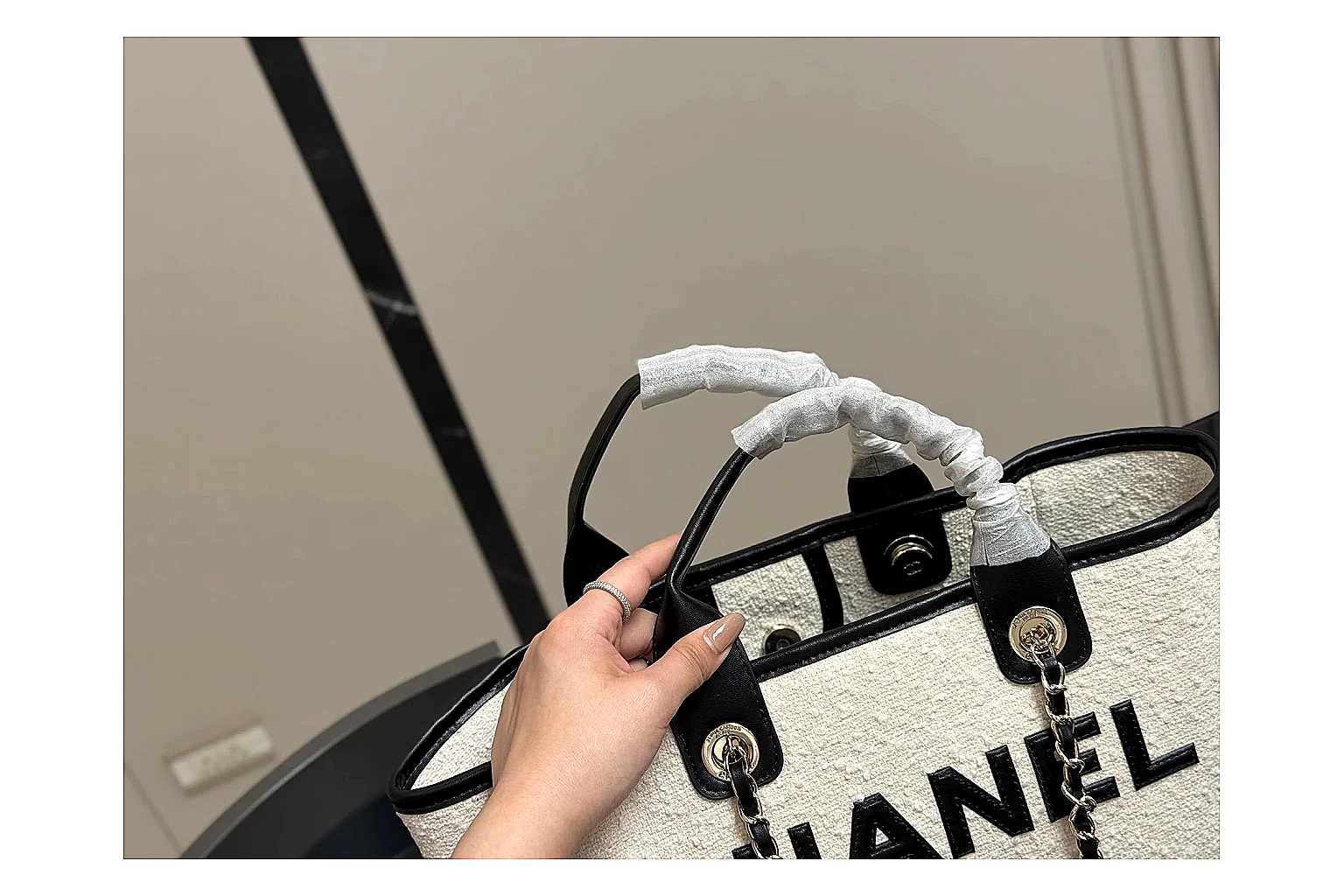 Chanel Tote Bag White Black shopping brief photo showing white black canvas-leather tote body, open carry shape, structured handles, and branded luxury-bag details thumbnail 5